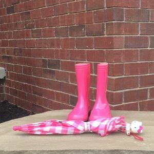 Girls pink rain boots with an umbrella